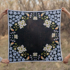 Black Gentian 100% silk scarf, Floral Bird Design by Matty Miller, held open outdoors