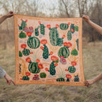 Cactus Garden 100% silk scarf, Desert Botanical Pattern by Matty Miller, held open outdoors