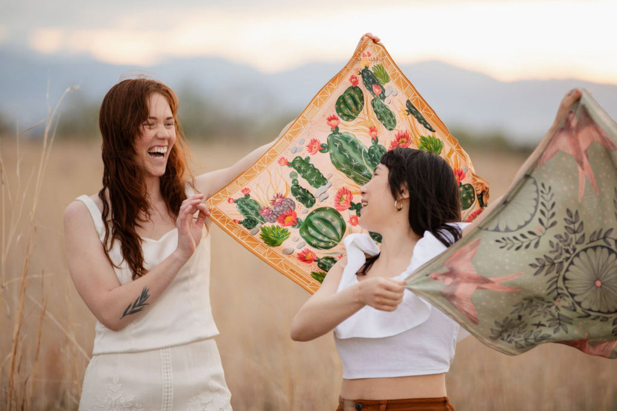 Cactus Garden and Skylark 100% silk scarves by Matty Miller, worn outdoors