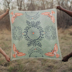 Plume 100% silk scarf, Owls & Florals by Matty Miller, held open outdoors