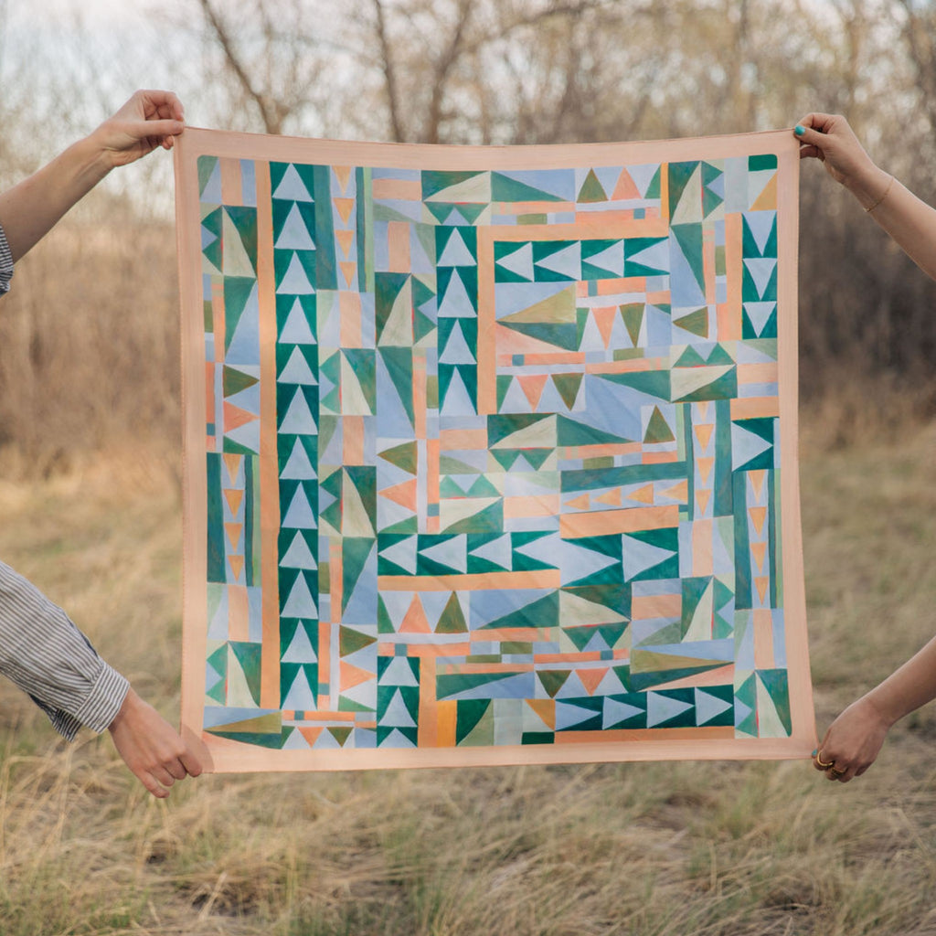 Prism 100% silk scarf, Abstract Geometric Pattern by Matty Miller, held open outdoors